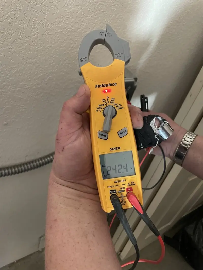 Voltage testing with clamp meter during Generator Installation in Milford Mill